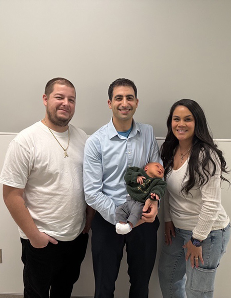 Dr. Cameron Sadegh with Andrew and Brittney Izquierdo and their newborn son.